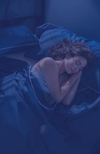 Woman asleep in bed | SleepTest.co.uk